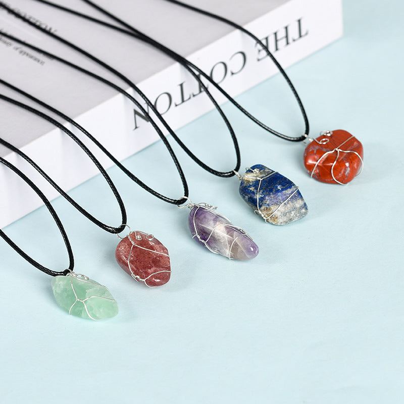 Raw crystal on coil pendant necklace